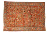 Vintage Heriz carpet with an allover geometric pattern on a brick red field and a sky blue turtle design border.