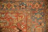 Close-up of the vintage Heriz corner with its geometric turtle samovar border in sky blue.