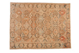 Vintage distressed Bakhtiari carpet with an allover panel design of blossoms and cypress trees in earthy, muted tones.
