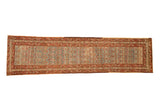 Vintage distressed Karabagh runner with floral motifs on a dusty teal field and a faded raspberry red triple border.