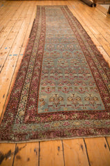 Angled view showing the full length and scale of the vintage Karabagh rug runner.