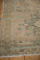 Texture of a distressed Heriz rug showing even wear to the knot heads and geometric design.