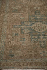 Even wear and low pile texture of a vintage Heriz rug with sand and dusty seafoam blue tones.