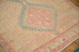 Close-up view of the distressed Serab runner's texture showing knot heads and soft color abrashes.