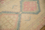 Close-up of the distressed texture on a vintage Serab rug showing mostly even wear to knot heads.