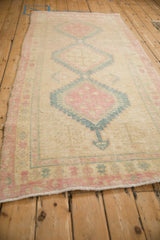 Interconnected geometric medallions viewed from a low angle on the distressed Serab runner.