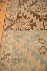 Detail of the serrated geometric patterns and low pile of a distressed antique Karabagh rug.