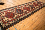 A long view of the vintage Serab runner showing its repeating column of geometric medallions.