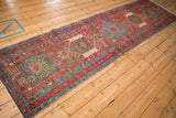 A full-length perspective view of a vintage Karaja runner's column of geometric medallions.