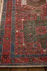 Angled view of the Karaja runner's starburst border and hand-knotted texture.