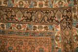 A close-up of the turtle samovar and floral borders in dusty blue, brown, and sandalwood.