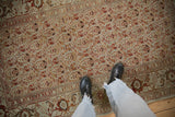 Even wear and repeating turtle samovar motifs on a distressed vintage Persian Malayer rug.