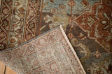 Distressed vintage Malayer rug corner, showing teal and rust pile over hand-knotted foundation.