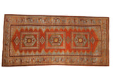Distressed Persian runner with three hexagonal medallions, a red serrated field, and a slate blue animal border.