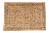 Distressed vintage Arak carpet with a diamond medallion and floral field in sand and chocolate brown.