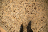 Distressed texture of a vintage Arak carpet showing floral details and mostly even wear to the knot heads.