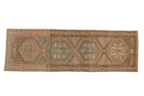 Distressed Persian Malayer runner with geometric hexagonal medallions in soft sand and powder blue tones.