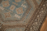 Close-up of the multiple narrow borders with meandering geometric designs on a Malayer rug.
