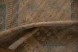 A folded view highlights the low, even pile and hand-knotted texture of the Malayer rug.
