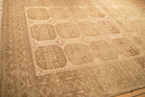 Angled view of a distressed Ersari carpet highlighting its low pile and repeating geometric guls.