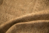 Close-up view of the evenly worn, hand-knotted pile of the distressed Ersari carpet.