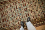 Evenly worn pile on an antique Borchalou runner with geometric floral and pomegranate designs.