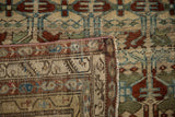 Folded corner of an antique Borchalou runner showing the low pile and machine-bound edge.