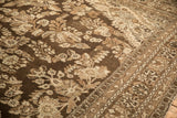 Detailed view of the low-pile texture and floral sprays on a distressed Kaboutrahang carpet.