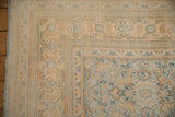 Corner of a vintage Agra carpet with lemon gold borders and a powder blue Herati field.