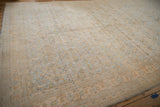 Soft, time-worn palette of powder blue and lemon gold in a distressed vintage Agra carpet.