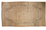 Distressed Bibikabad carpet with a central diamond medallion and Herati design in camel, ivory, and dusty blue shades.
