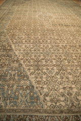 Worn texture of a vintage Bibikabad rug's Herati design with abrashed camel and dusty teal hues.
