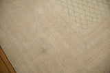 Close-up of a minor grayed surface stain on the distressed ivory pile of the vintage Sarouk.