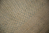 Distressed low pile on a vintage Sarouk carpet showing mostly even wear to the knot heads.