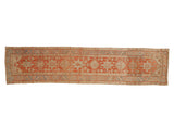 Vintage distressed Heriz runner with geometric medallions in brick red, powder blue, and ivory.