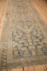 Long perspective view of a distressed Malayer runner highlighting its time-softened colors and low pile.