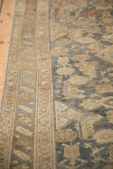 Close-up of the vintage Malayer's starburst border and low pile with even wear.