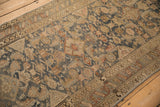 Starburst and leaf motif border on a distressed vintage Malayer runner with a Herati field.