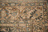 Close-up of the trefoil palmette and serrated leaf arabesque on a vintage Bakhtiari carpet.