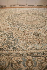 Low-angle perspective across a vintage Bakhtiari carpet showing its time-softened texture and pattern.