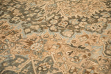 Evenly worn low pile of a vintage Bakhtiari showing intricate camel and dusty teal floral motifs.