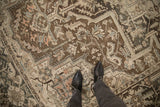Distressed low pile texture of a vintage Persian Heriz carpet with coffee brown and silver tones.