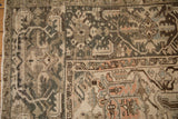 Herati-inspired border with scrolled leaves showing the carpet's mostly even wear.