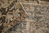 Folded corner of a distressed Heriz rug showing the low pile and its hand-knotted foundation.