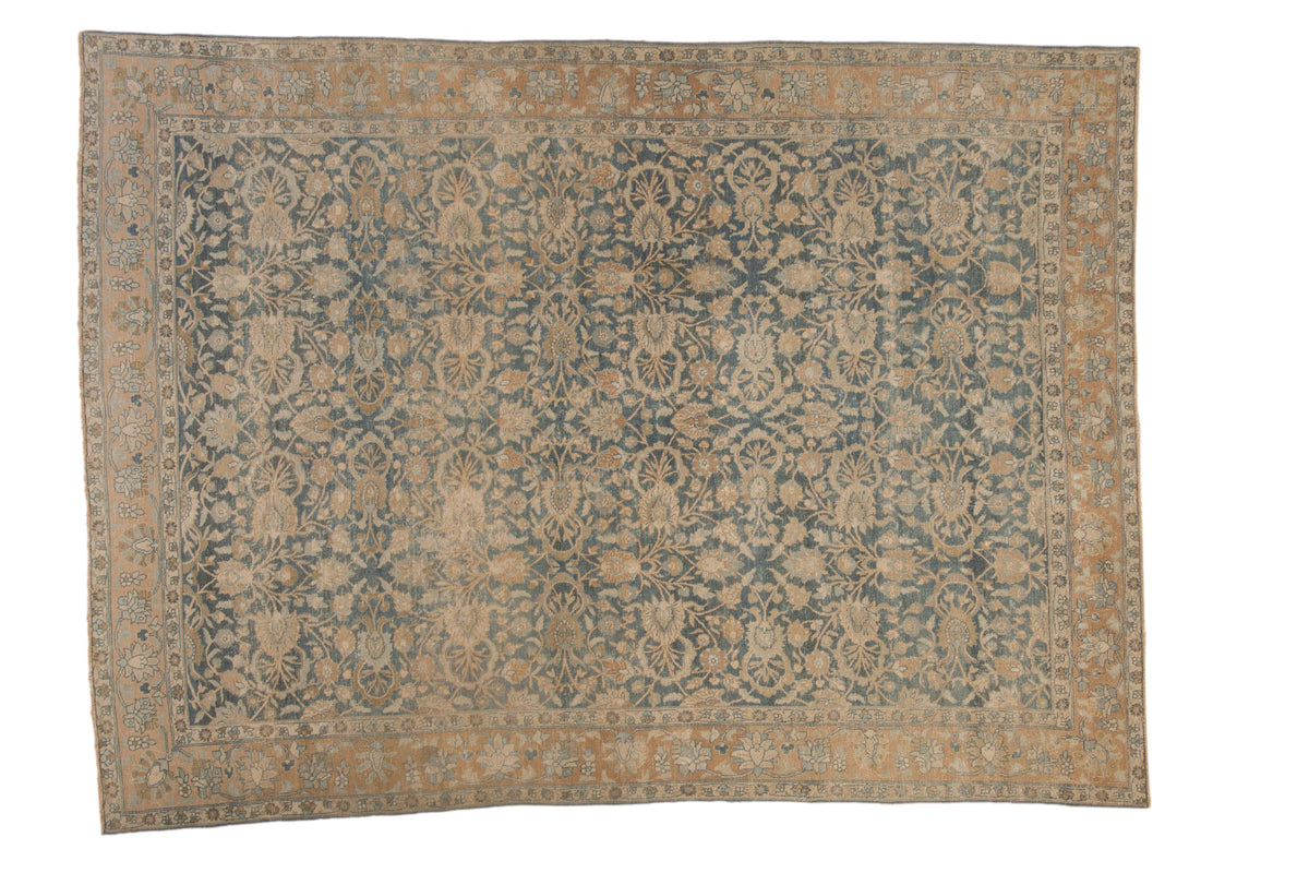 Vintage distressed Tabriz carpet with an allover floral palmette design in sky blue, sand, and ivory.