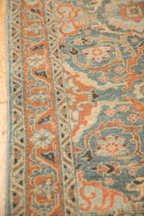 Expressive scrolling vines and arabesque floral border on a distressed Persian Malayer rug.