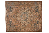 Vintage distressed Bakhtiari carpet with a large starburst medallion in coffee brown, sapphire blue, and ivory.