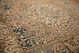 Angled view of a vintage Bakhtiari's lotus flower border and distressed, low-pile field.