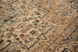 Low-pile texture and woven floral patterns on a distressed vintage Bakhtiari carpet.