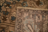 Back of a vintage Bakhtiari carpet showing the hand-knotted foundation and machine-bound edge.